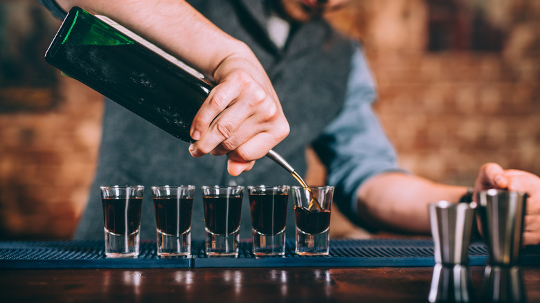 Bartender pouring shots of fernet