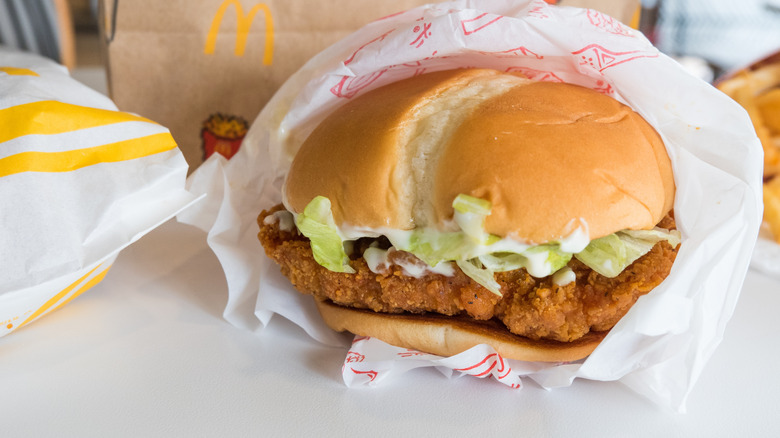 A McCrispy sandwich in a paper wrapper