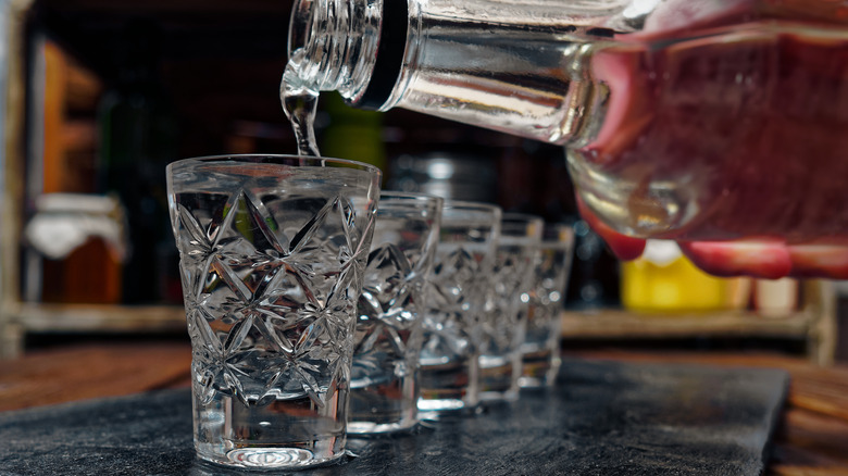 Pouring shots of vodka from bottle