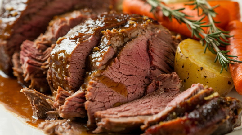 Slow-cooked pot roast with vegetables and herbs