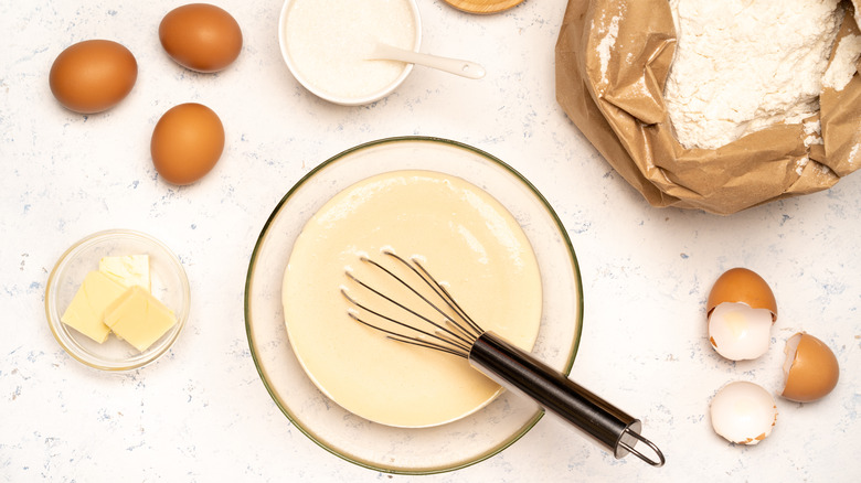 Eggs and flour whipped in a bowl to make batter