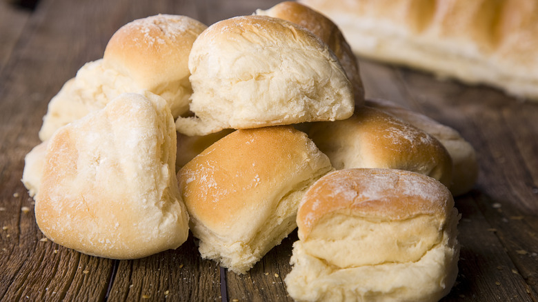 dinner rolls on wooden table