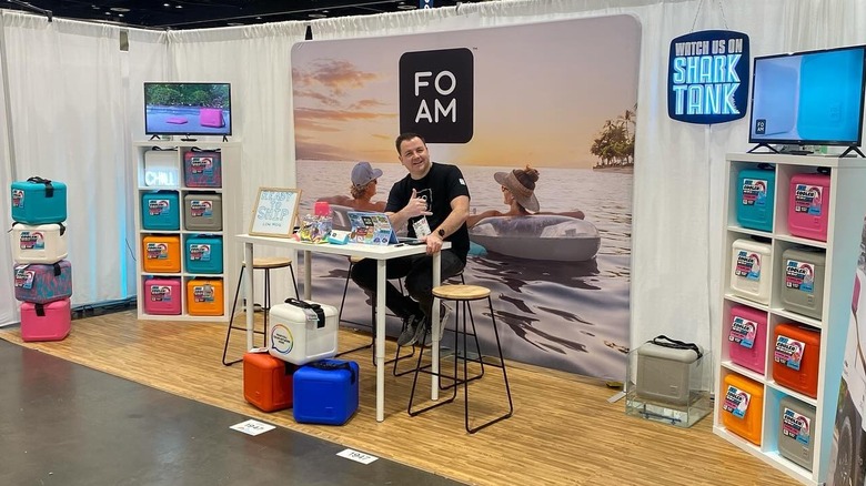 FOAM Coolers co-founder Chad Lee sits at a booth at the 2025 Surf Expo in Orlando, Florida