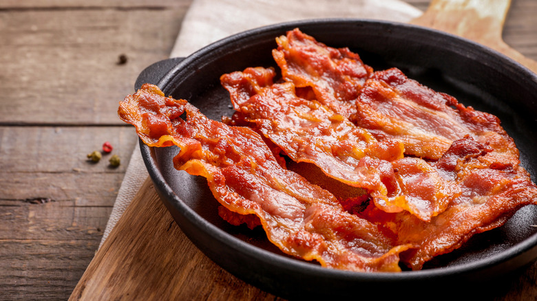 Crispy strips of bacon in a skillet