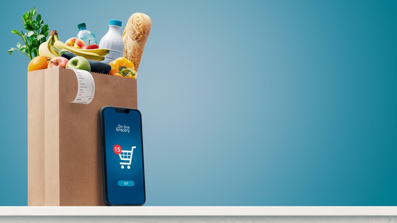 Bag of groceries and smart phone