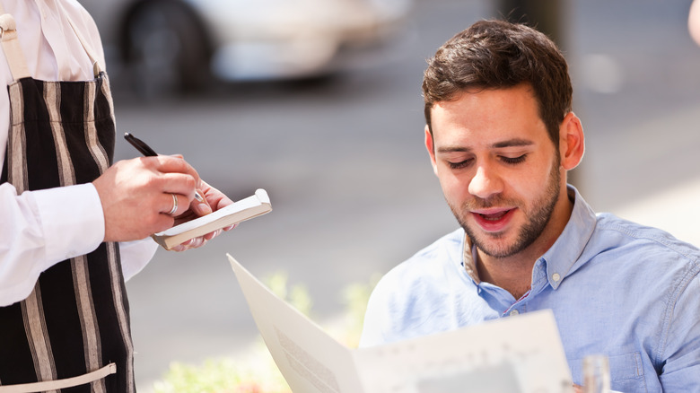 man ordering at a restaurant