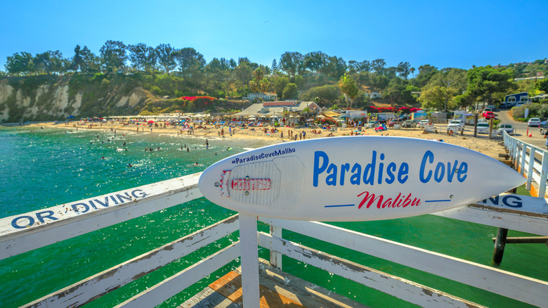 paradise cove surf board sign on pier in malibu