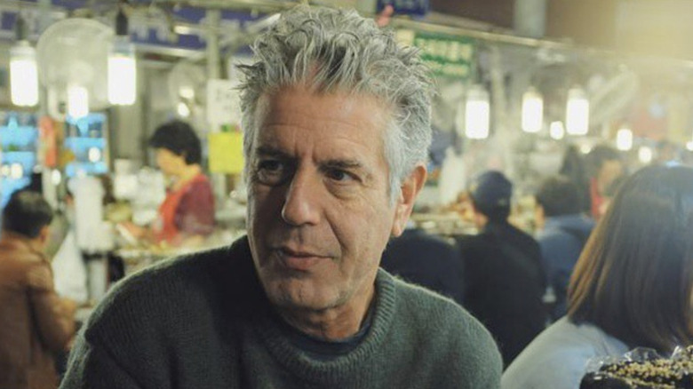 Anthony Bourdain eating at a street stall