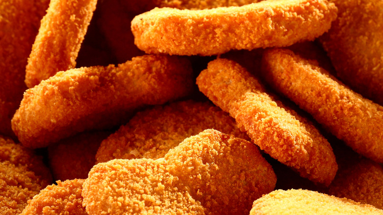 Three chicken mcnuggets close up