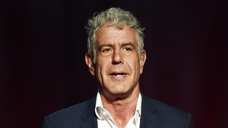 Anthony Bourdain formal image black background