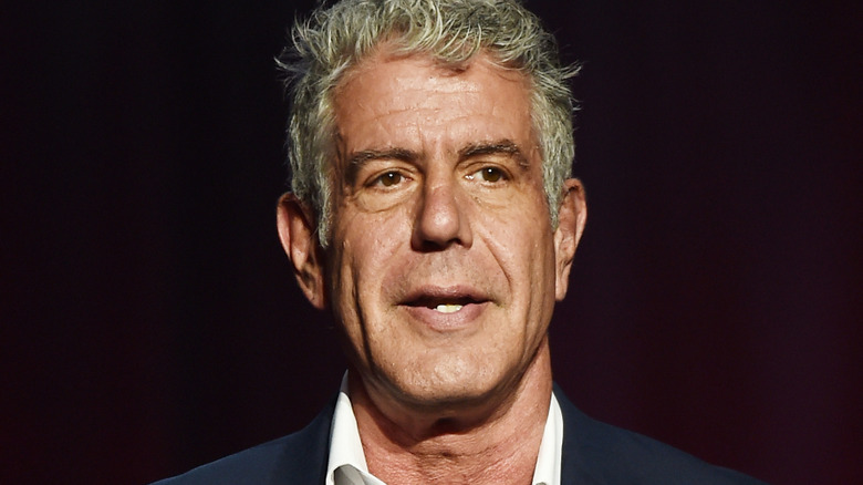 Anthony Bourdain formal image black background