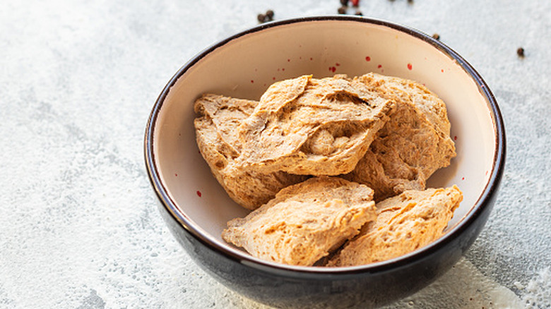 Seitan sits in a bowl.