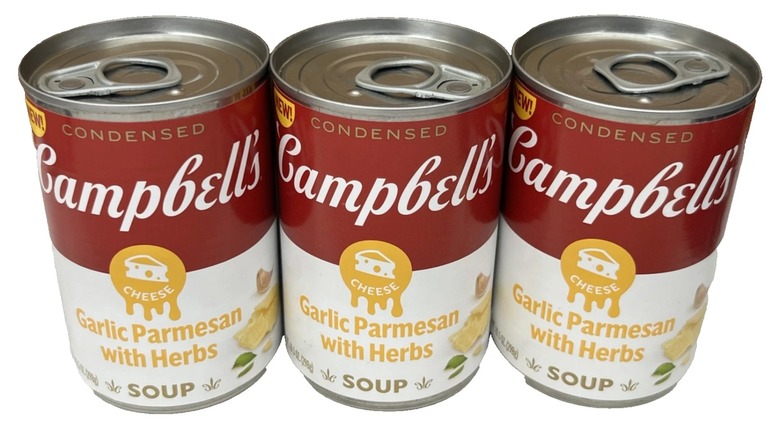 Three cans of Campbell's Garlic Parmesan soup with herbs