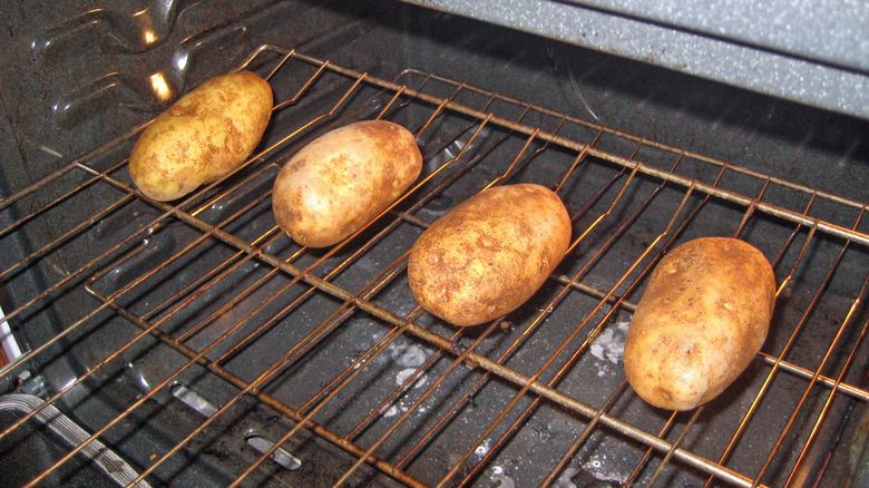 Baked potatoes on oven rack