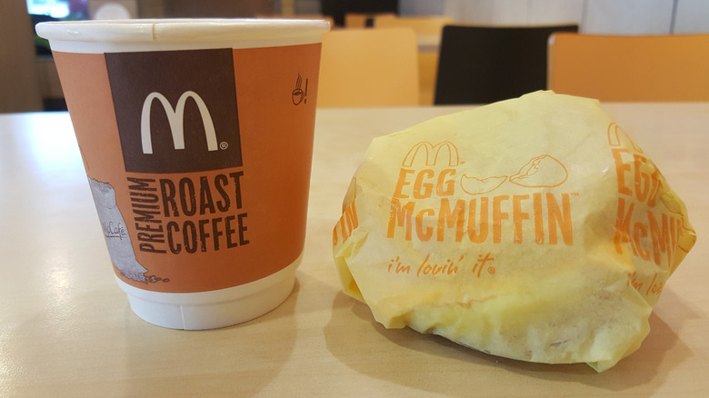 A McDonald's Egg McMuffin with coffee.