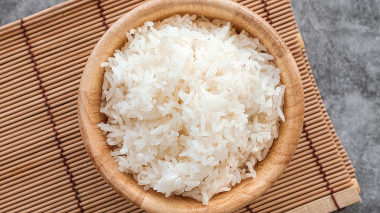 Fluffy jasmine rice in bamboo bowl