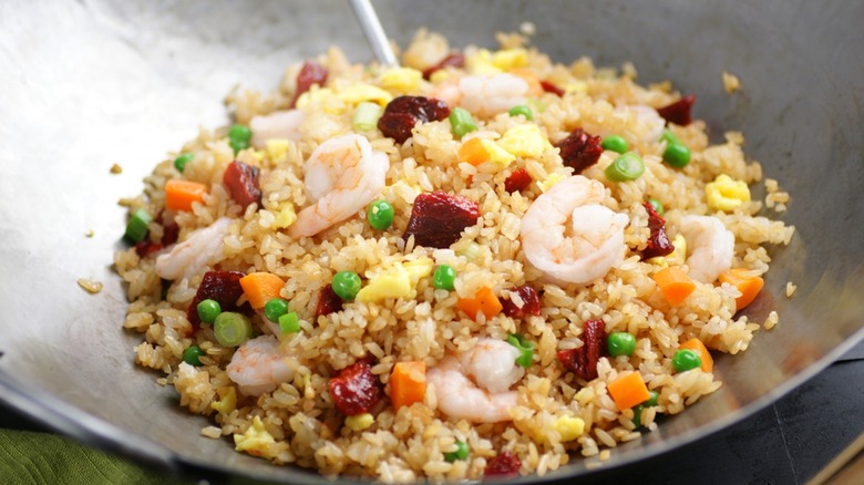 Egg and shrimp fried rice in wok