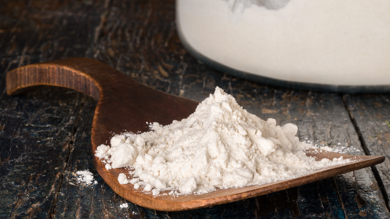 White flour on wooden utensil