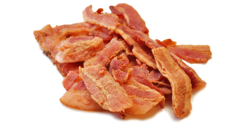 Dried bacon jerky on white background