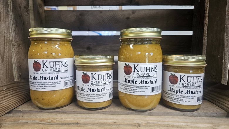 A variety of maple mustards sit in a row.