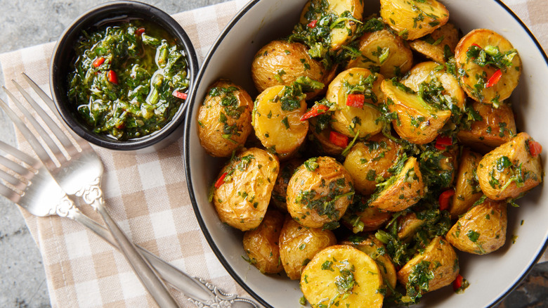 Roasted potatoes topped with chimichurri