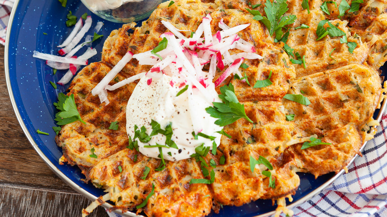 waffled hash browns served with sour cream