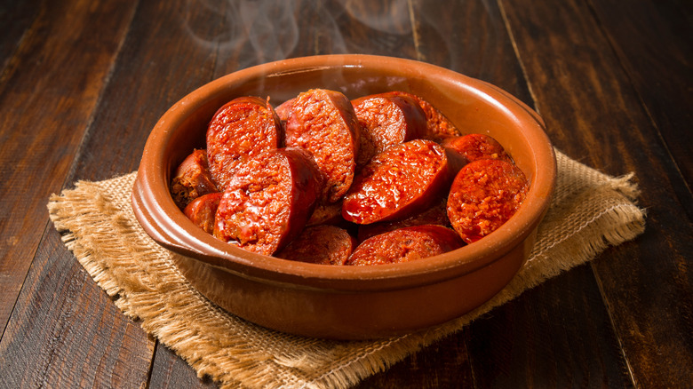 Sliced chorizo in a bowl.