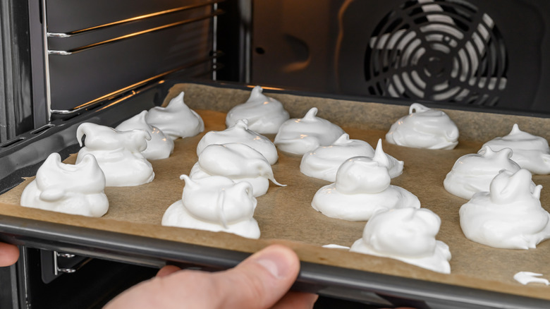 Meringue cookies that are being placed in the oven