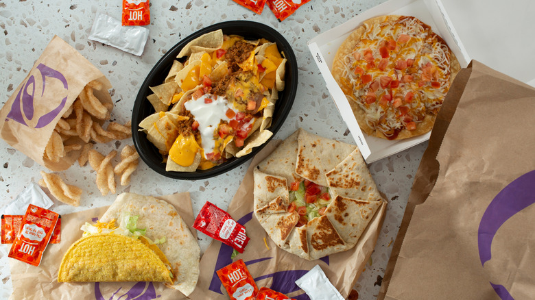 Various Taco Bell food items sit on a restaurant counter