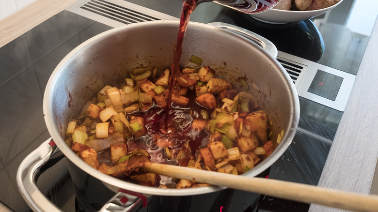 Deglazing a pan of vegetables