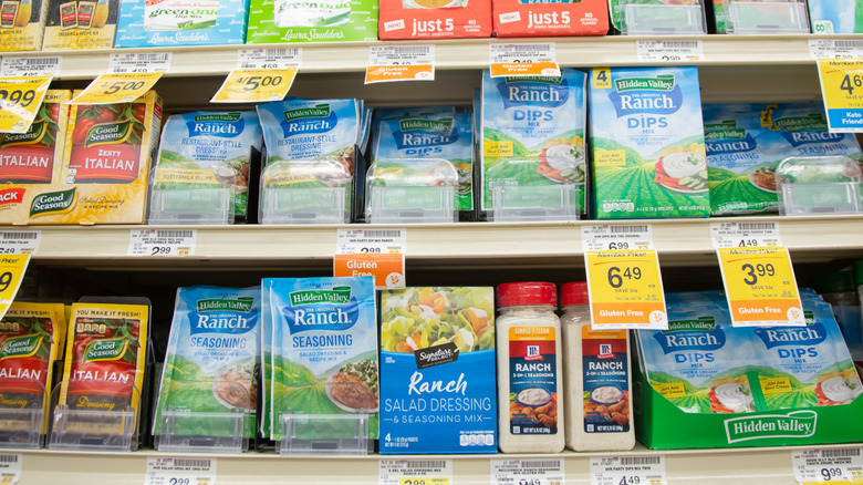 A grocery store shelf featuring different versions of dried ranch seasoning