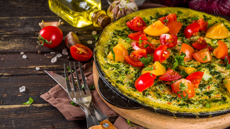 A frittata with greens and tomatoes