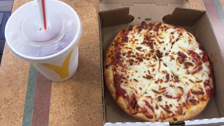 McPizza and McDonald's cup on a multi-colored table