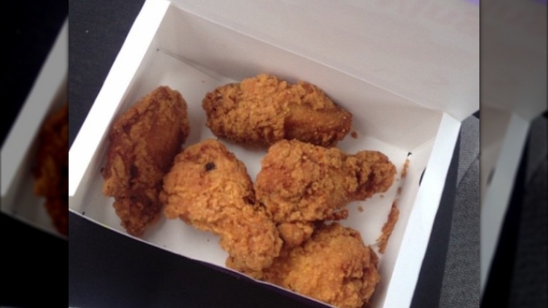 Five McDonald's Mighty Wings in a box