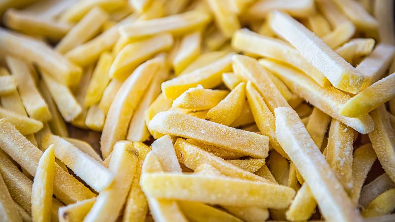 A large pile of frozen French fries