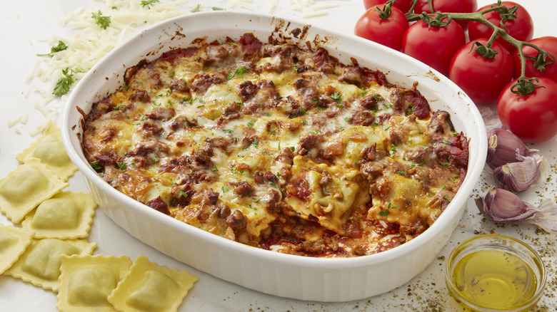 Ravioli baked casserole with melted cheese in baking dish