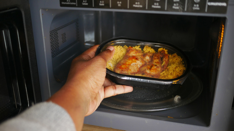Heating up a TV dinner in the microwave