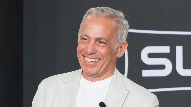 Geoffrey Zakarian smiling during a demonstration.