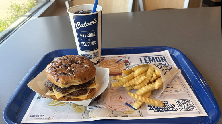 A Culver's food tray holding a burger, soda, and french fries