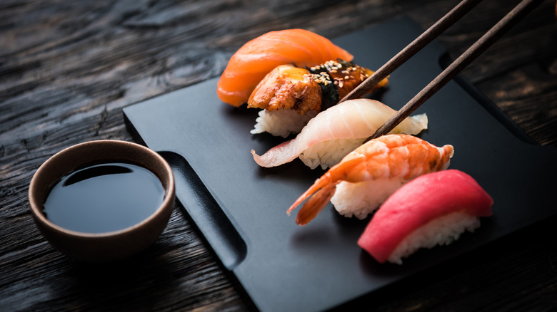Japanese nigiri on black platter