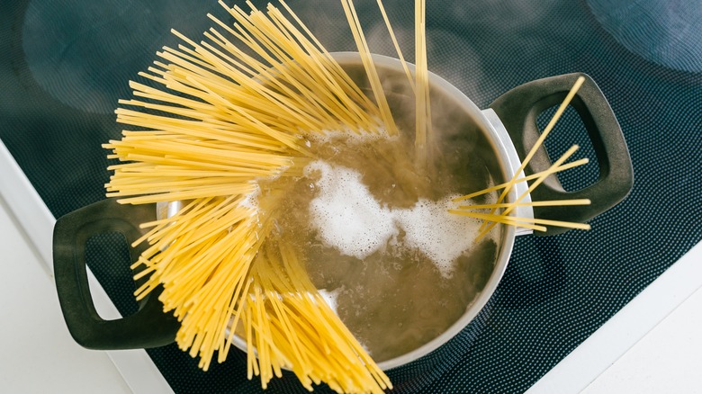 Pasta noodles cooking in water
