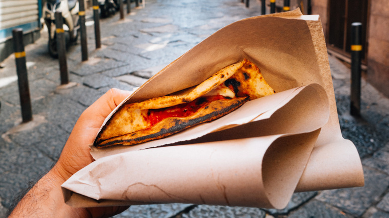 a pizza from a local Naples stall shop