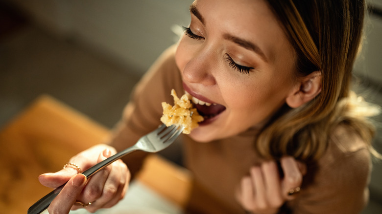woman eating pasta