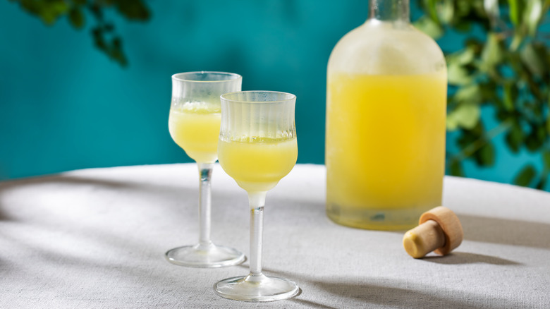 Two glasses and a bottle of limoncello