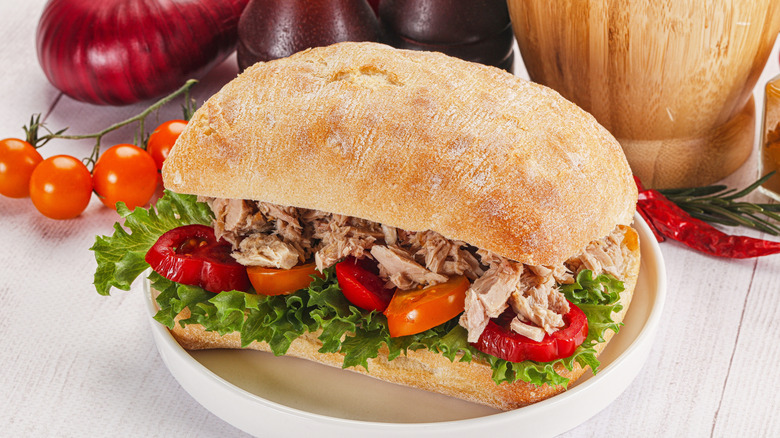 Tuna salad sandwich on ciabatta bread with fresh tomato