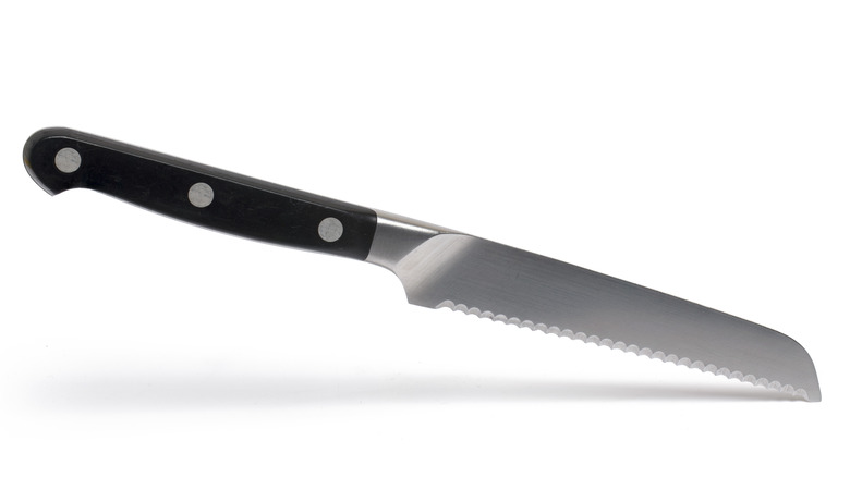 Serrated knife on white background