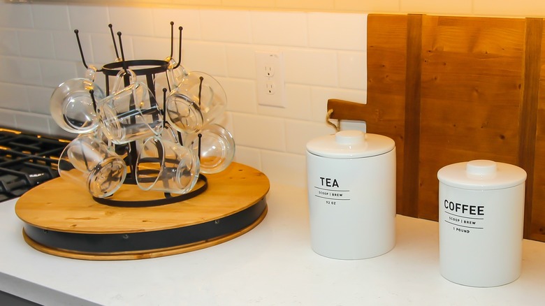lazy Susan on counter holding coffee mugs