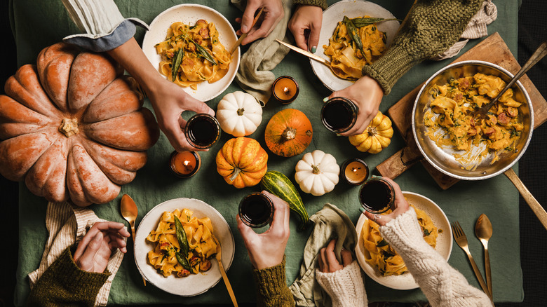People sharing pumpkin pasta