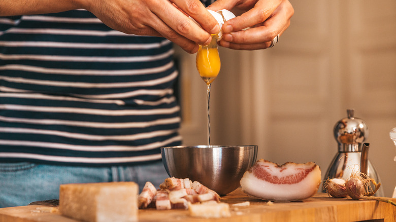 Cracking egg for pasta carbonara