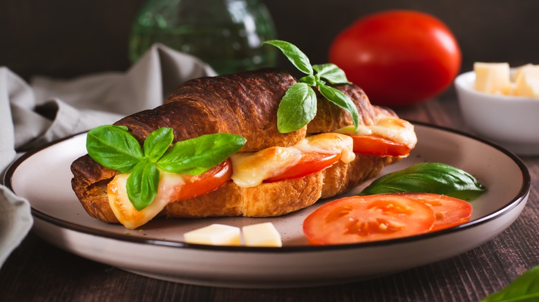 Caprese baked croissant with mozzarella, tomato, and basil